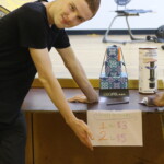 Kaleb (Year 12) showing off the raffle and prizes for Year 12 graduation fundraising.